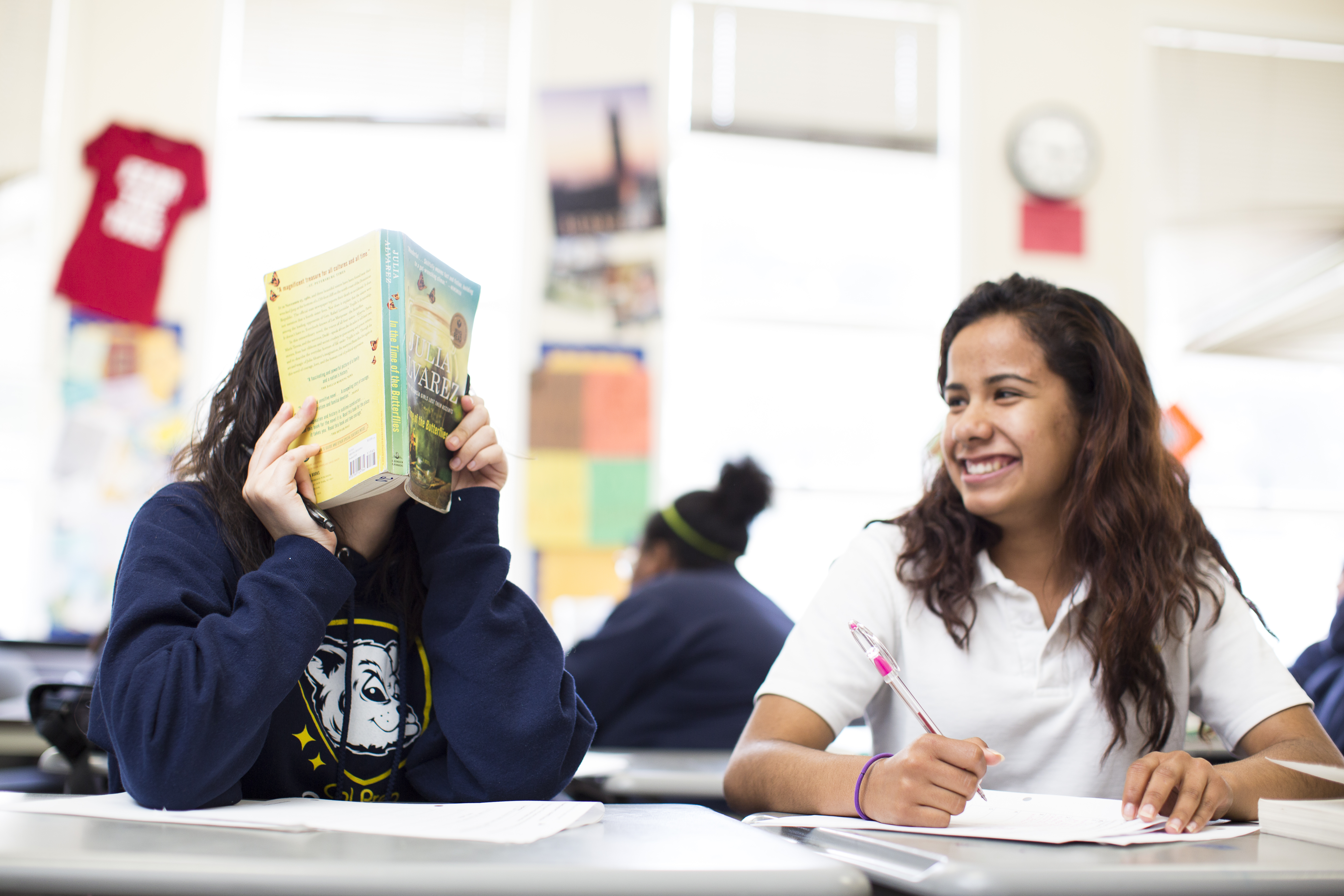 two students with a book